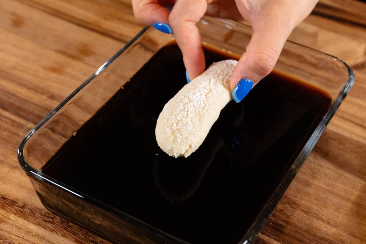 dunking lady fingers into espresso