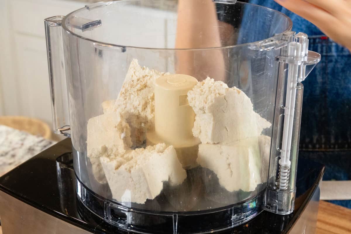 adding tofu to a food processor