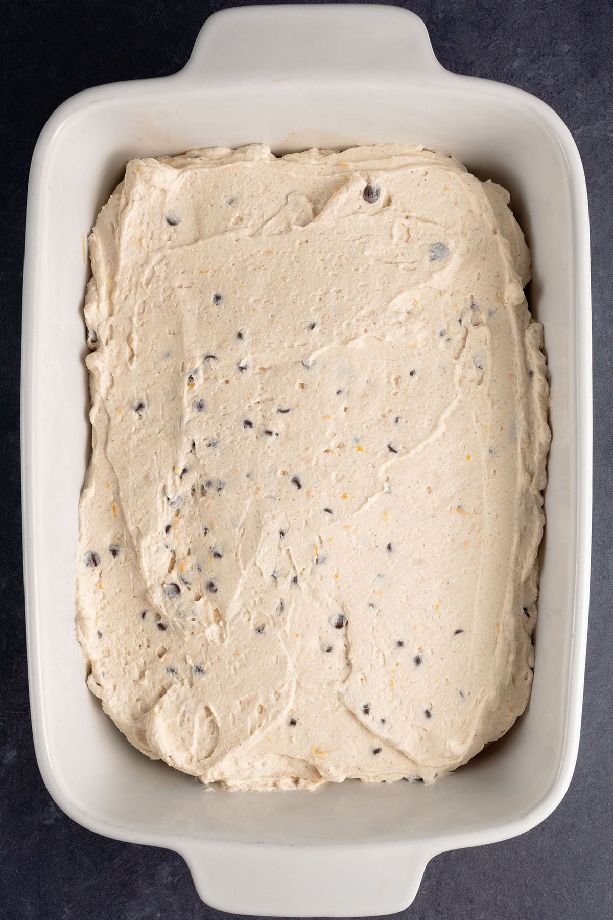 layer of cannoli cream in a baking dish
