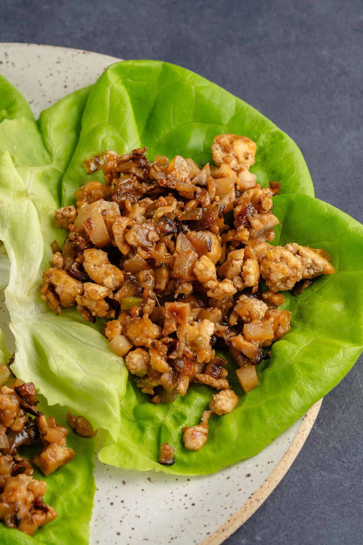 finished PF chang copycat tofu lettuce cups on a plate before topping