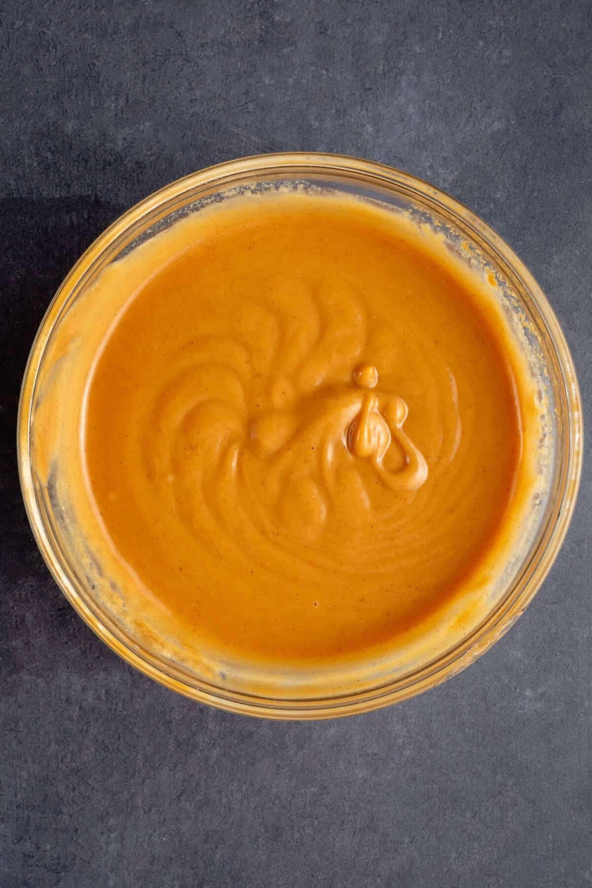 creamy homemade peanut sauce in glass bowl