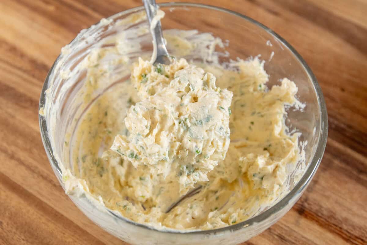 scoop of garlic butter from bowl