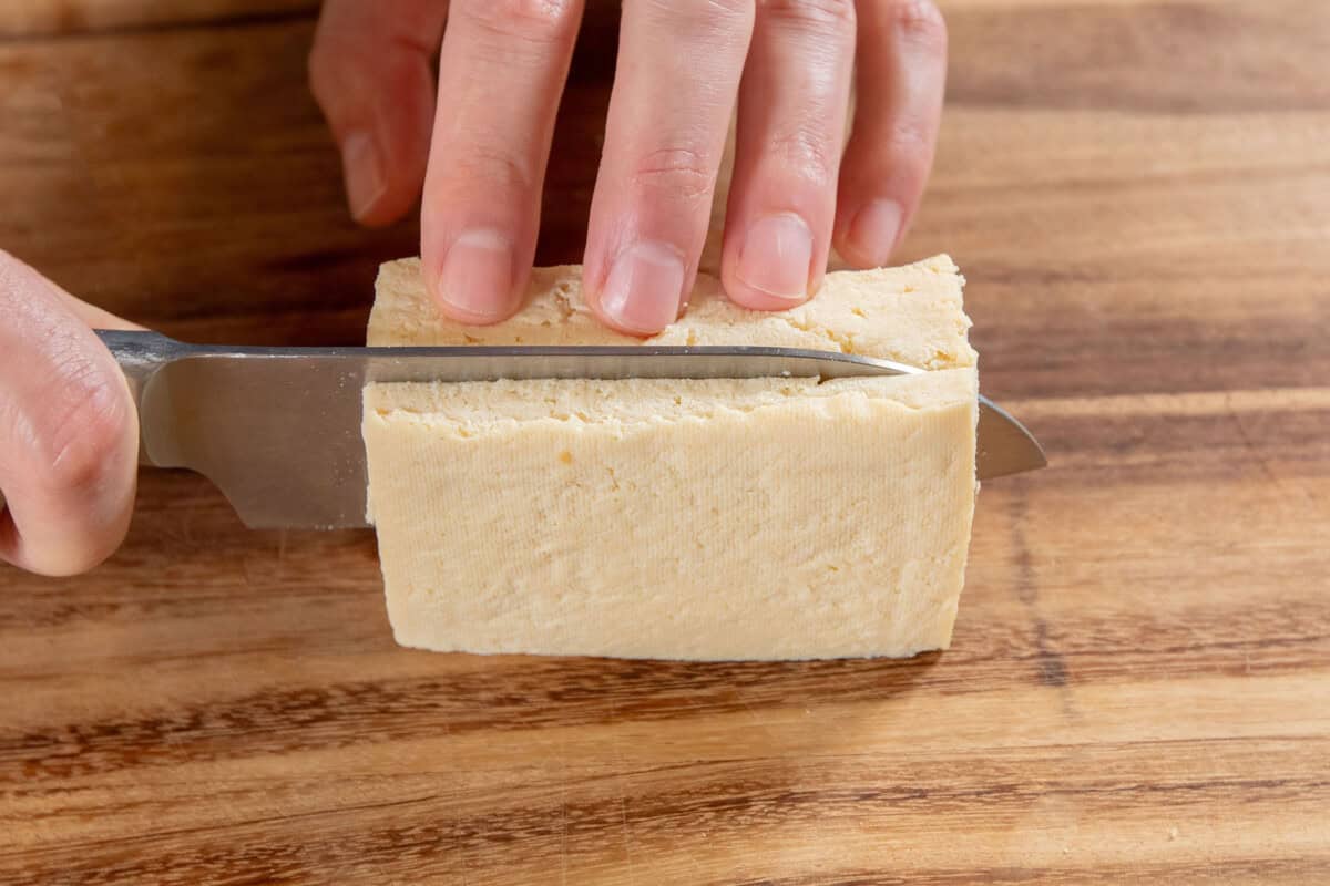 Slicing tofu into slabs