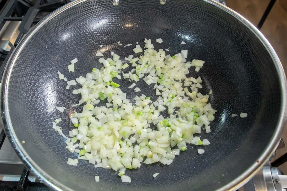 onions being cooked in large skillet