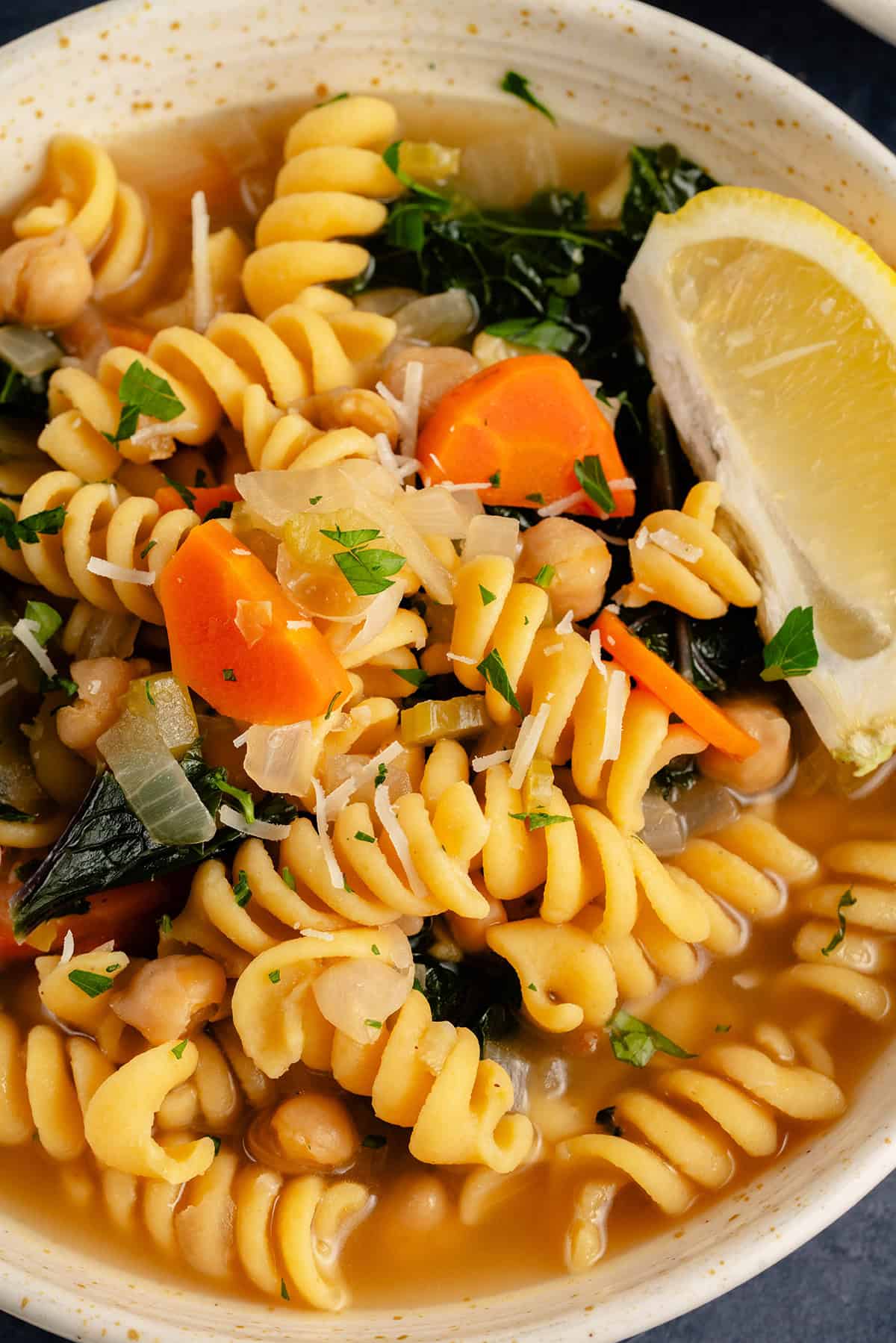 close up of bowl of chickpea noodle soup