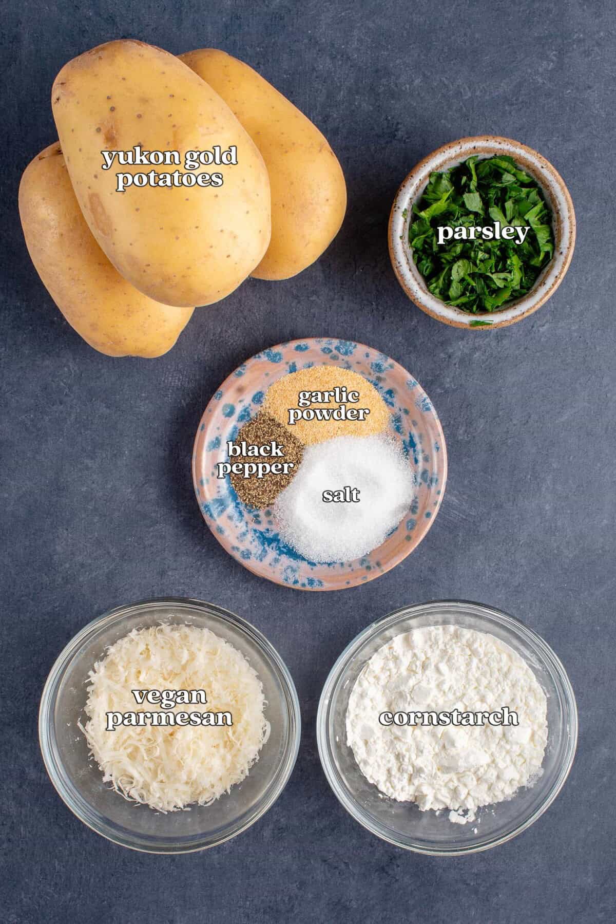 labeled ingredients for crispy fried potato balls: yukon gold potatoes, parsley, garlic powder, black pepper, salt, vegan parmesan and cornstarch