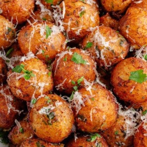 close up of bowl full of vegan Crispy Potato Balls