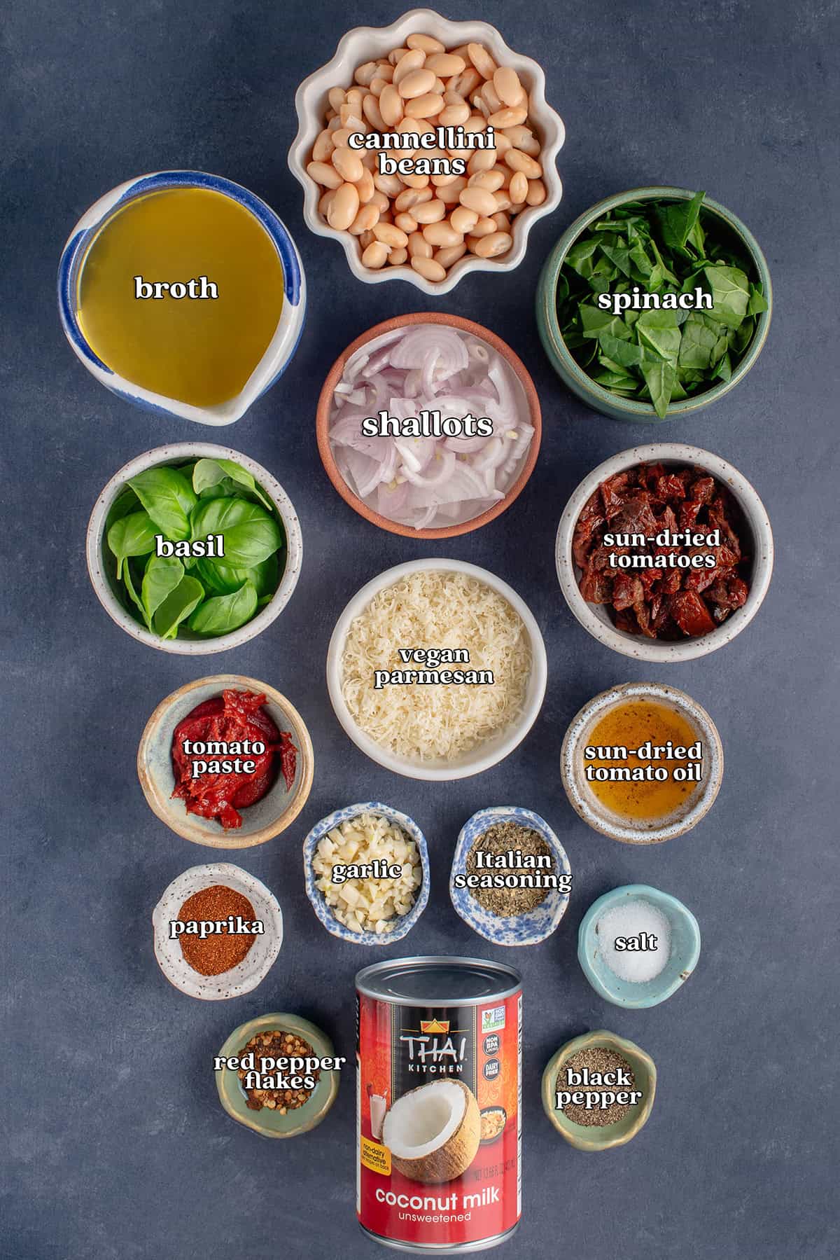 cannellini beans, broth, shallots, spinach, basil, vegan parmesan, sun-dried tomatoes, tomato paste, garlic, Italian seasoning, sun-dried tomato oil, paprika, salt, red pepper flakes, coconut milk, black pepper