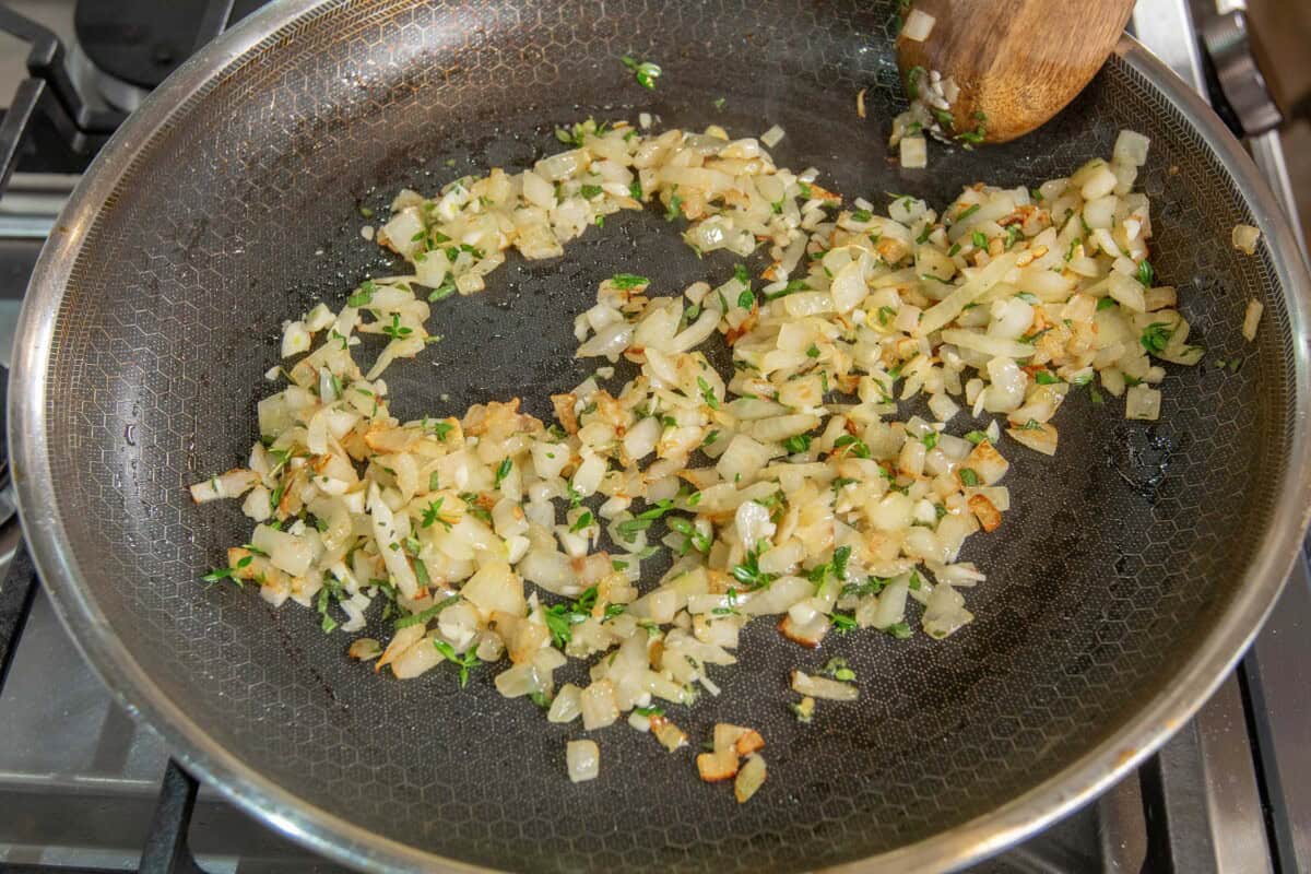 add garlic sage and thyme to the onions