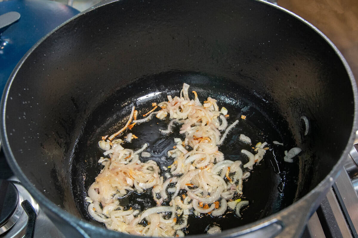 sautéing shallots in a pot