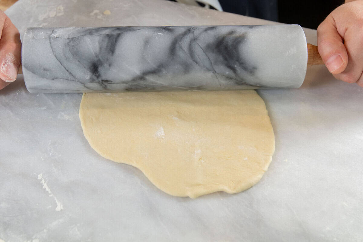 rolling out dough with a rolling pin