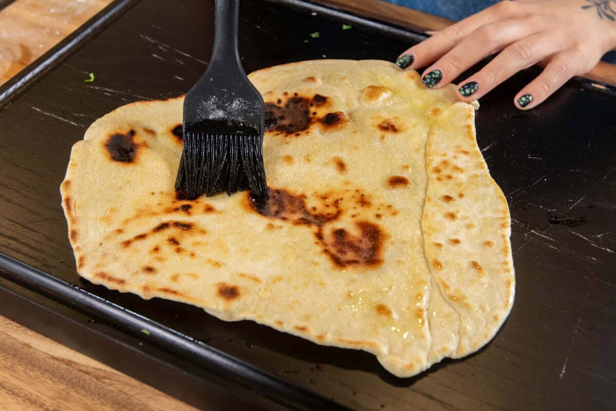brushing the flatbread with oil