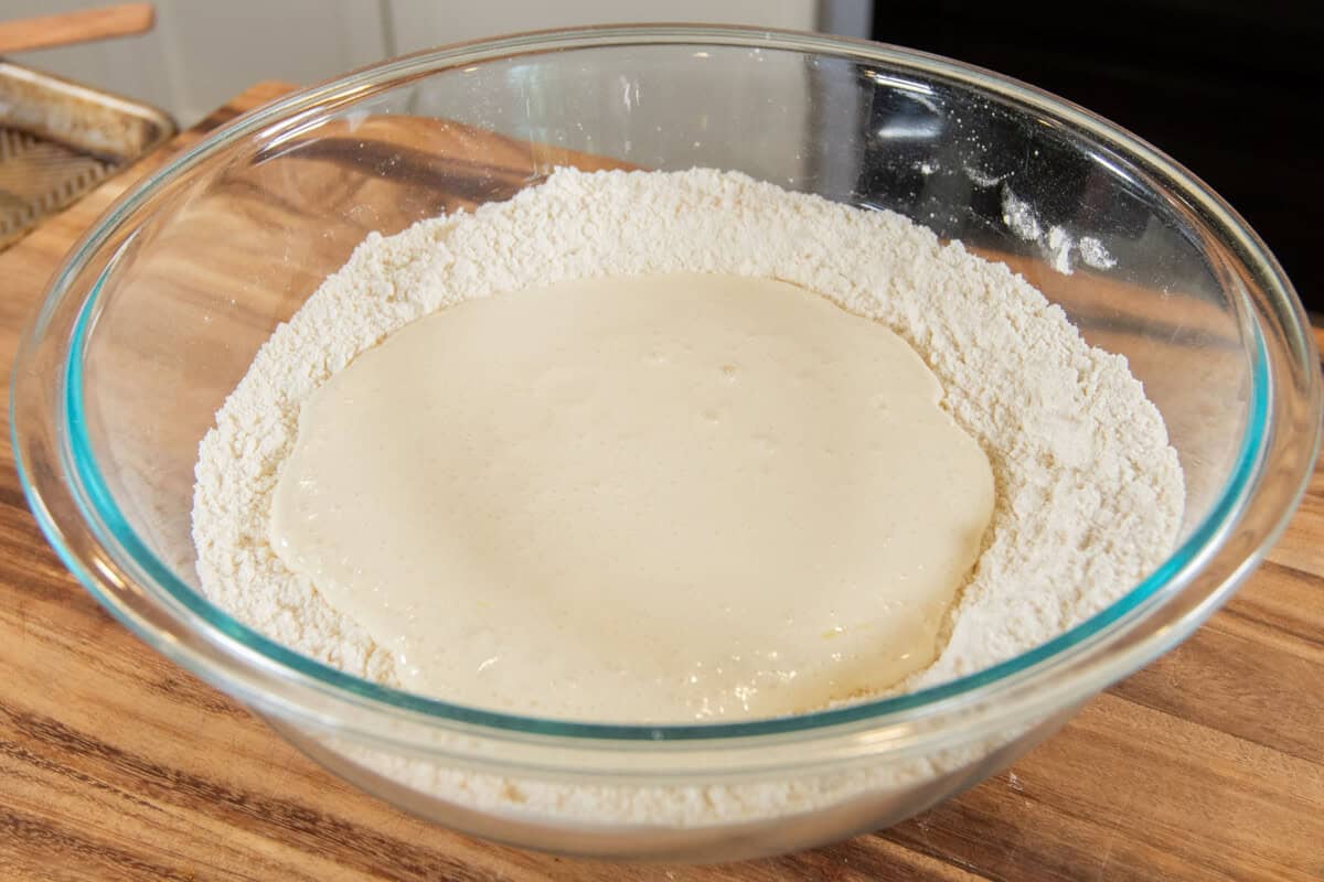 adding wet mixture into the flour