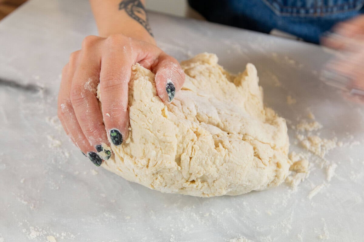 kneading dough on a marble slab
