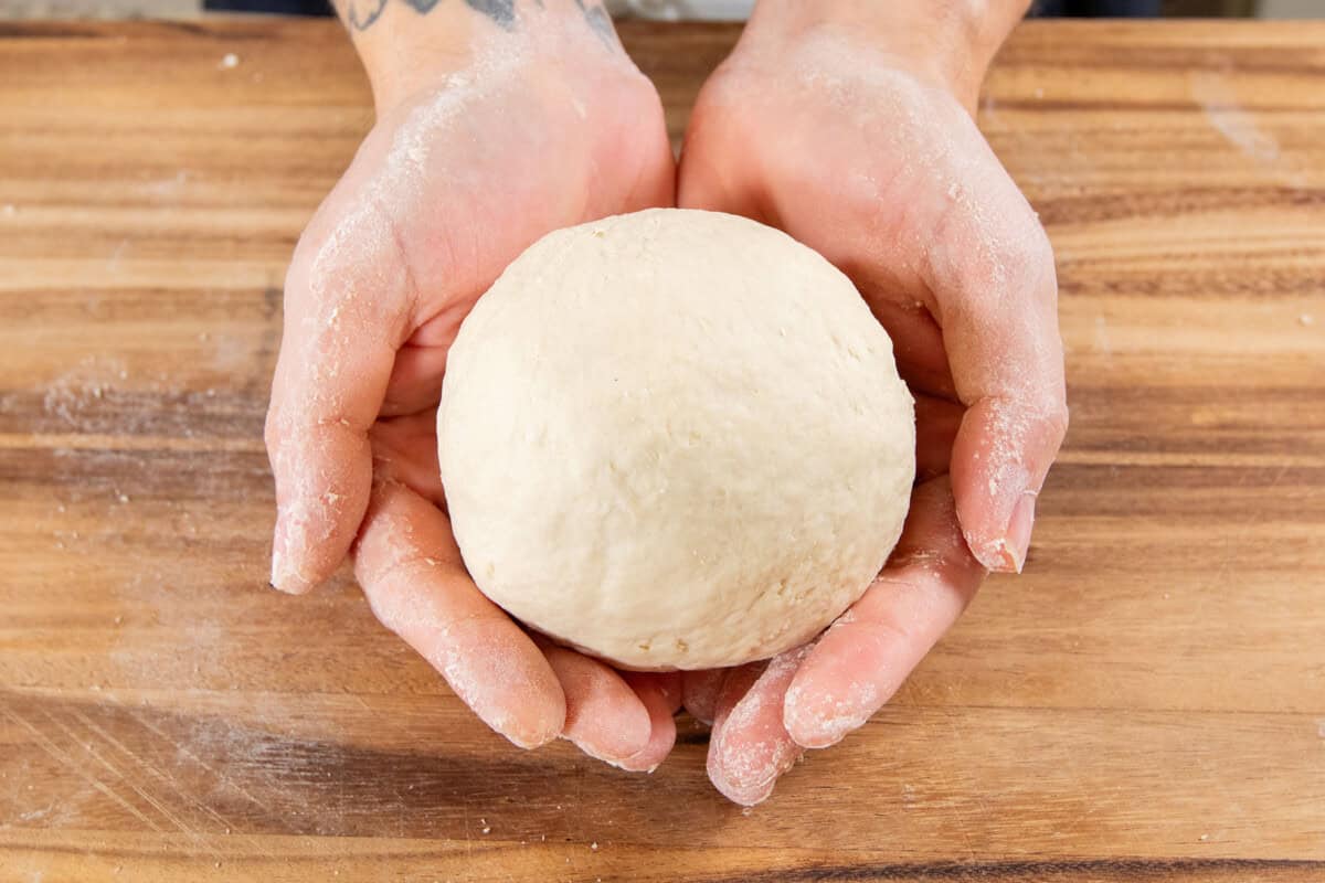 smooth ball of dough in hands