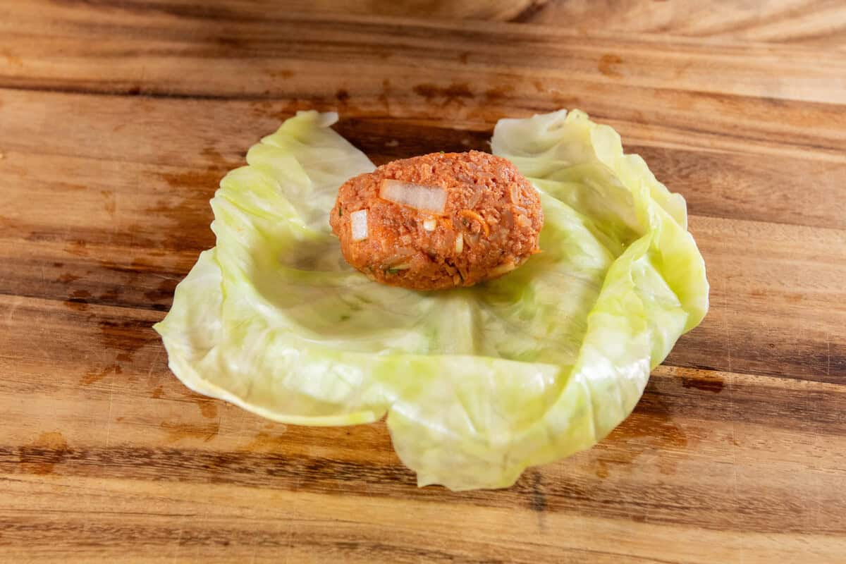 filling on top of cabbage leaf before rolling