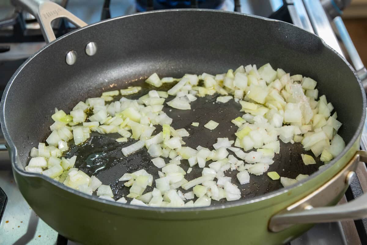 onions sautéing in skillet