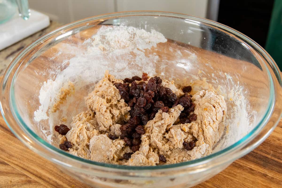 adding raisins to the dough