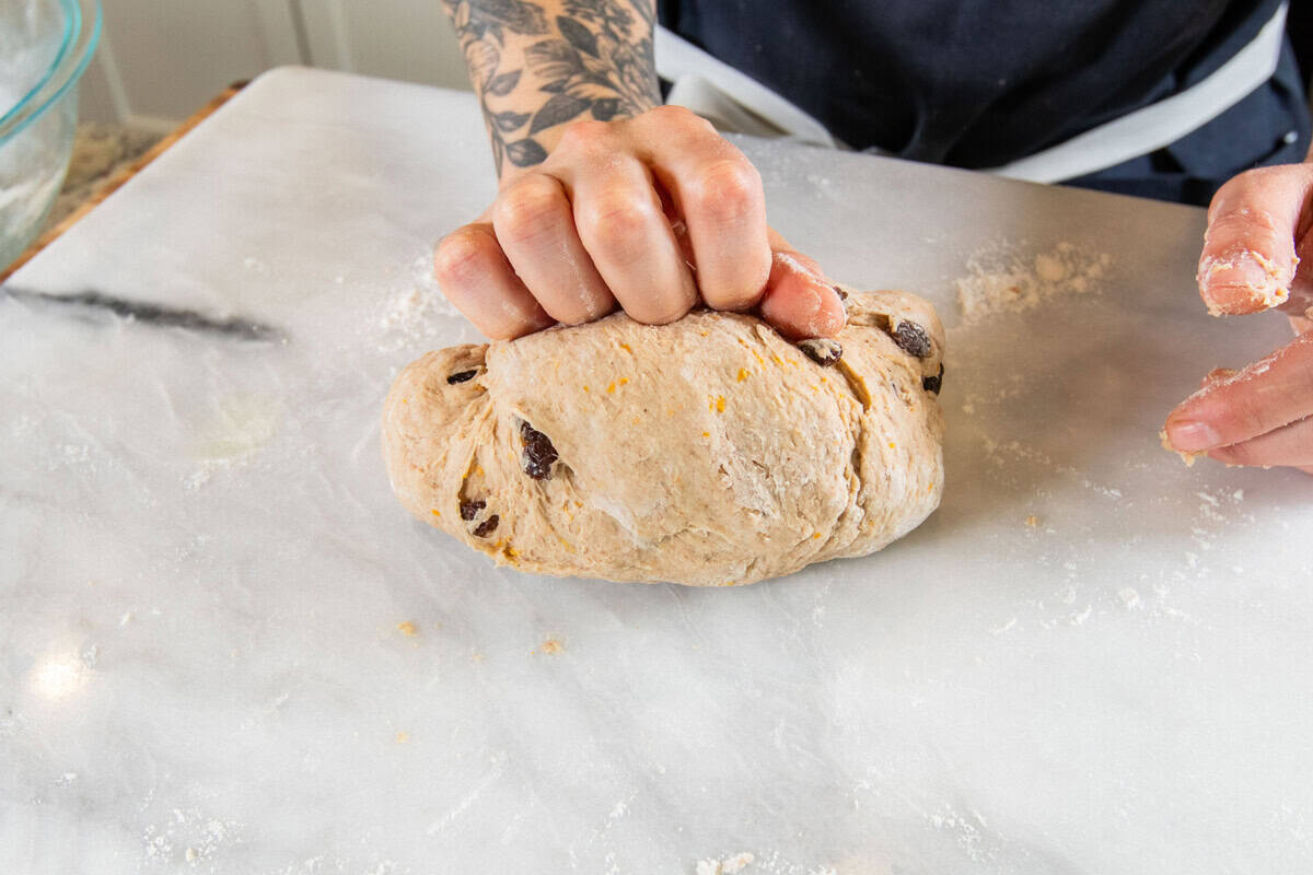 kneading dough on marble surface