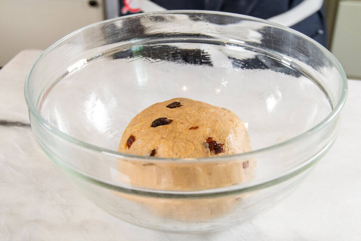 dough in large glass bowl before rising