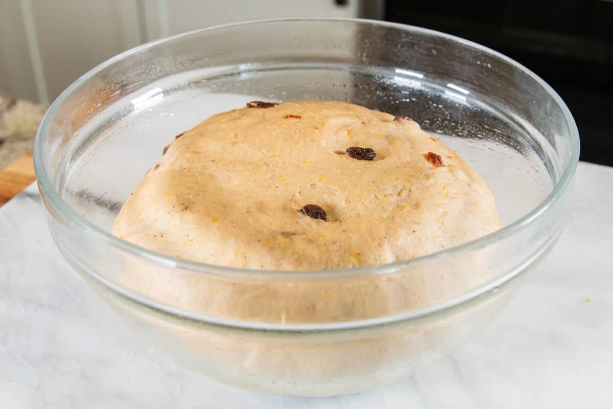 risen dough in large glass bowl