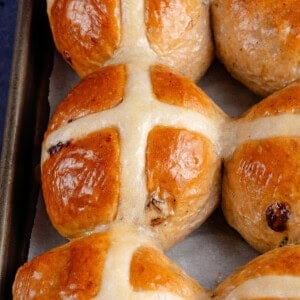 baked vegan hot cross buns on a baking sheet