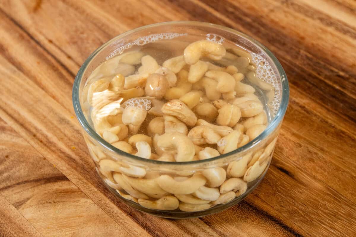 soaking cashews in small bowl with hot water