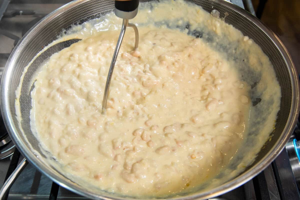mashing beans in put of creamy sauce