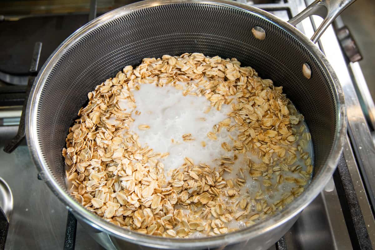 adding coconut milk to the oats