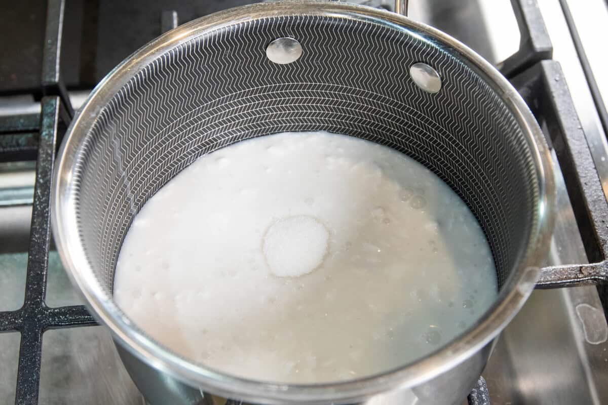 adding sugar to the saucepan