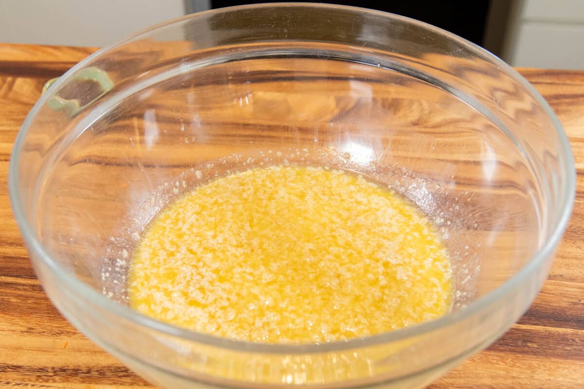 activated yeast in a large bowl with butter