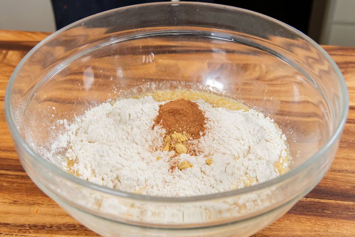 adding the dry ingredients to a large bowl