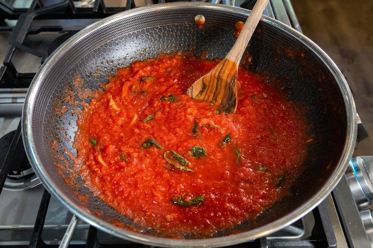 homemade tomato sauce in large pot for Pasta alla Norma (Eggplant Pasta) recipe