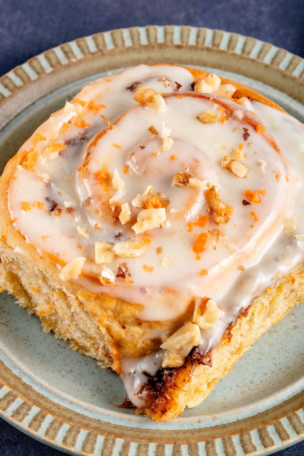 vegan carrot cake cinnamon roll on a plate