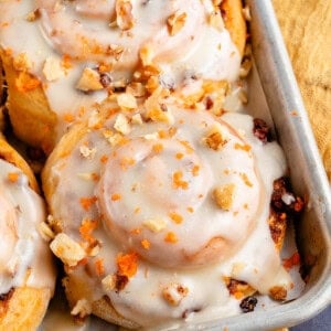 vegan carrot cake cinnamon rolls in baking sheet
