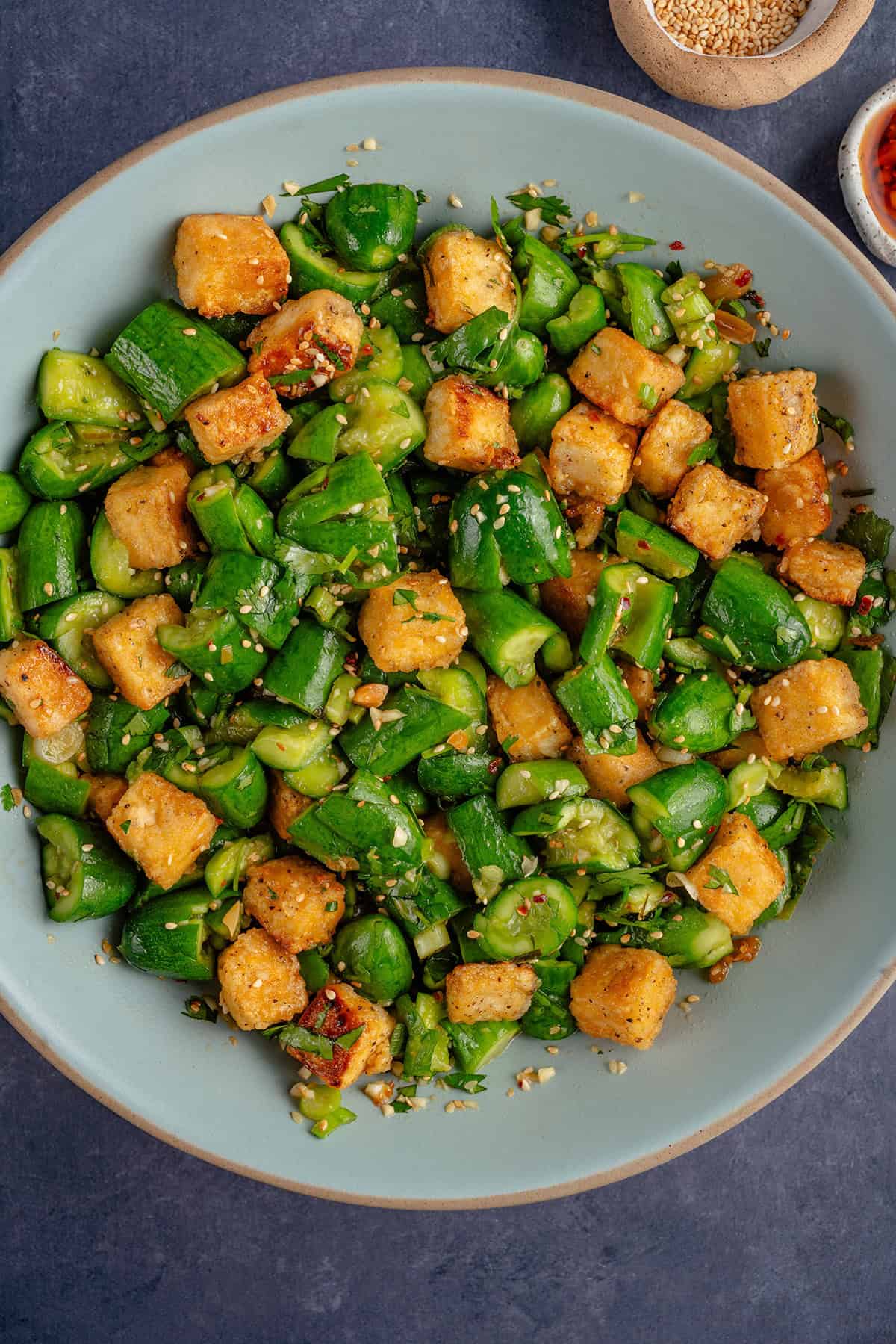 Smashed Cucumber Salad with Tofu in a bowl