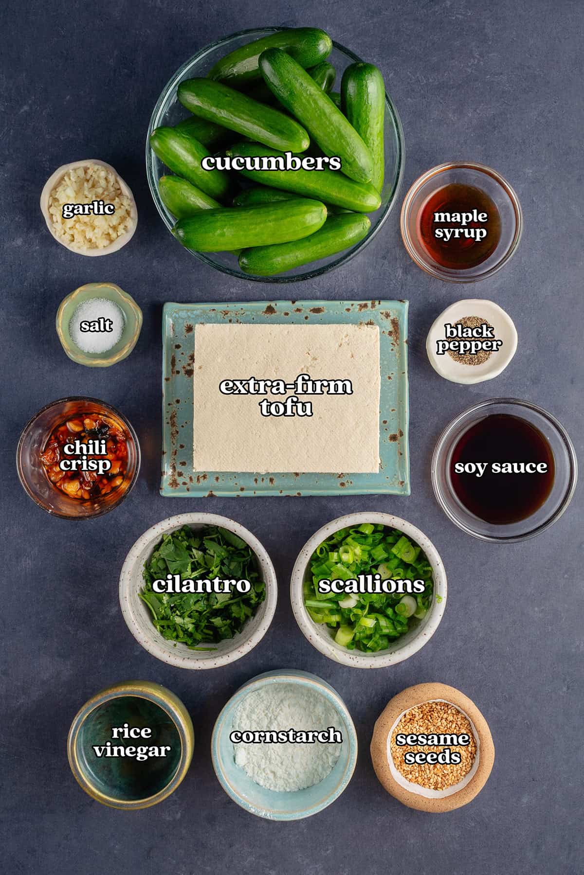 cucumber garlic, maple syrup, salt, extra-firm tofu, black pepper, chili crisp, soy sauce, cilantro, scallions, rice vinegar, cornstarch, sesame seeds