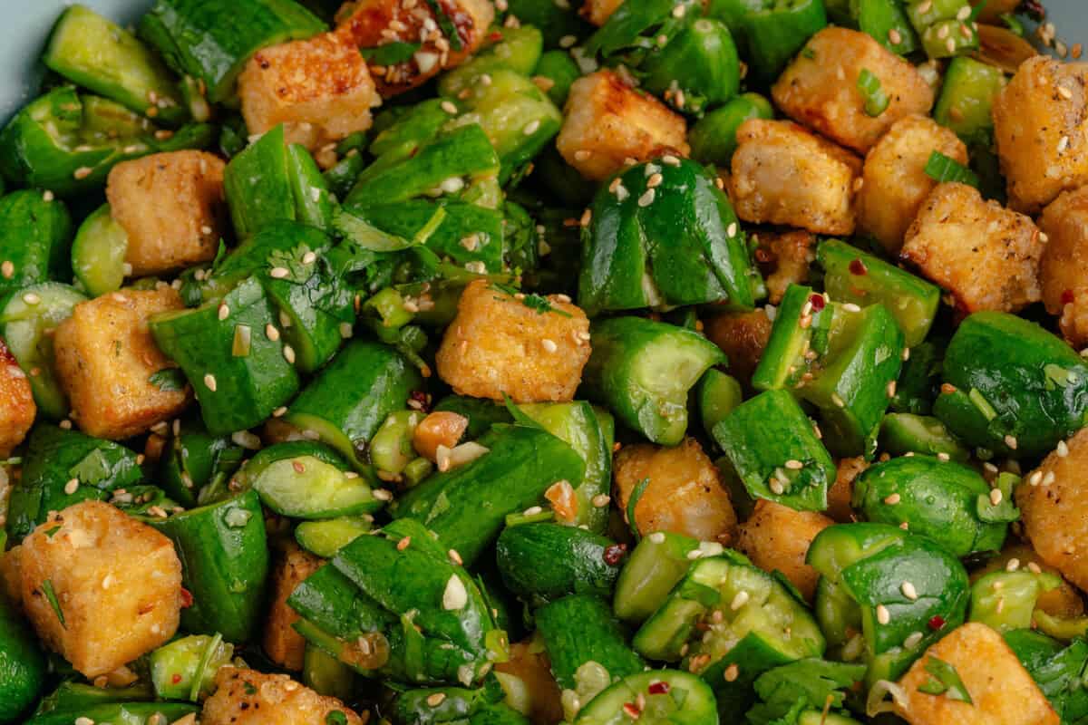 close up of Smashed Cucumber Salad with Tofu in a bowl