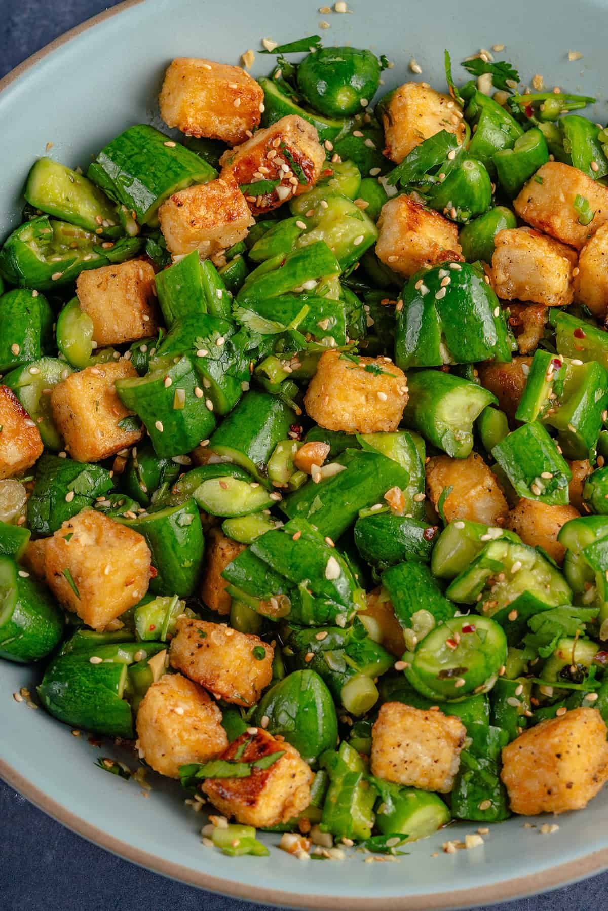Smashed Cucumber Salad with Tofu in a bowl