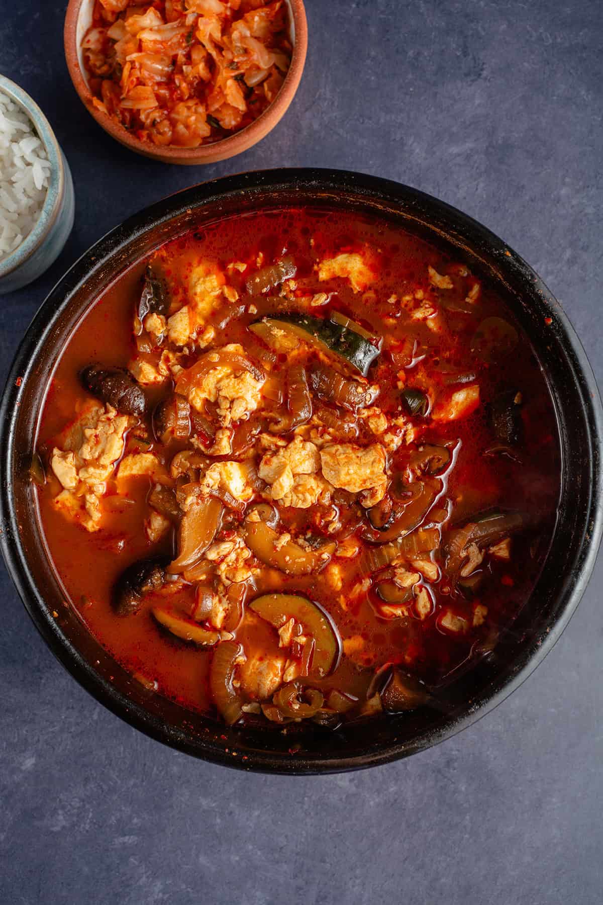 Vegan Sundubu-Jjigae (Korean Soft Tofu Stew) in earthenware pot
