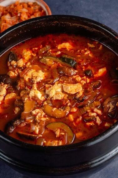 Vegan Sundubu-Jjigae (Korean Soft Tofu Stew) in earthenware pot