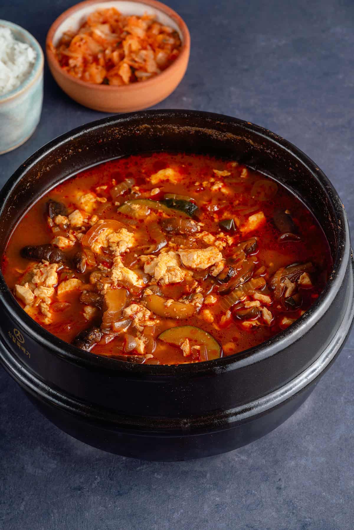 Vegan Sundubu-Jjigae (Korean Soft Tofu Stew) in earthenware pot