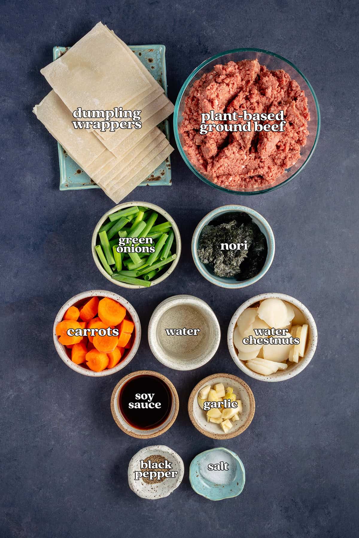 dumpling wrappers, plant-based ground beef, green onions, nori, carrots, water, water chestnuts, soy sauce, garlic, black pepper, salt