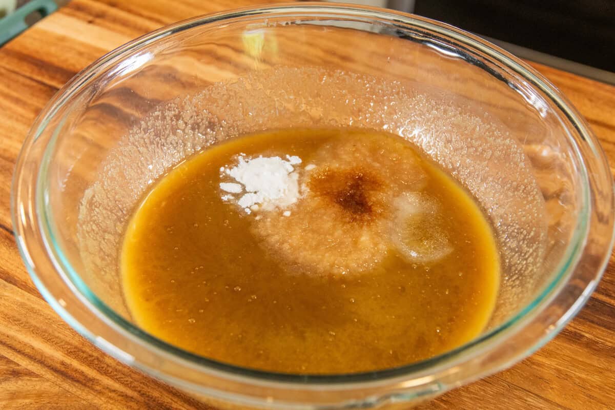 adding vanilla, applesauce, and baking power to the mixed butter and sugar
