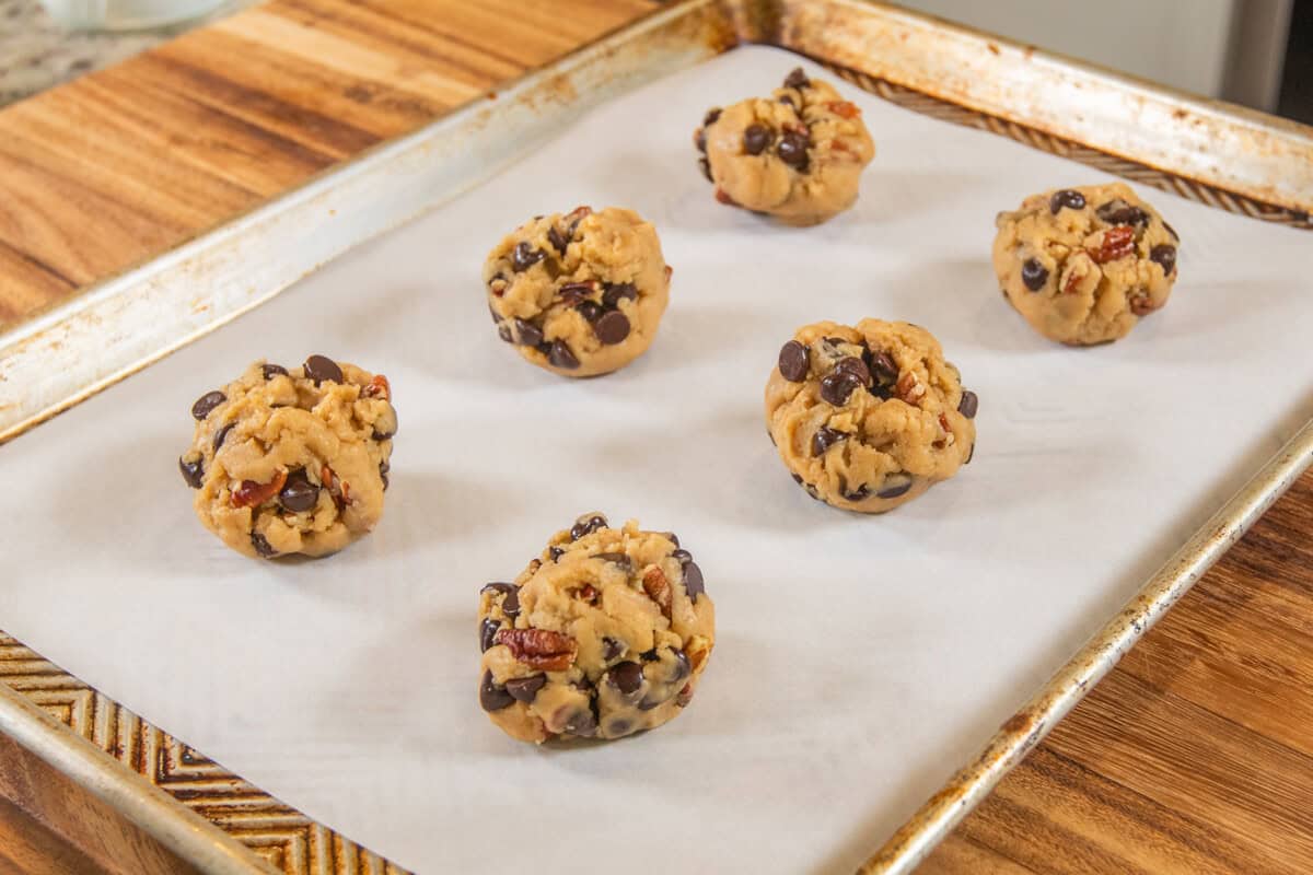cookie dough balls on baking sheet