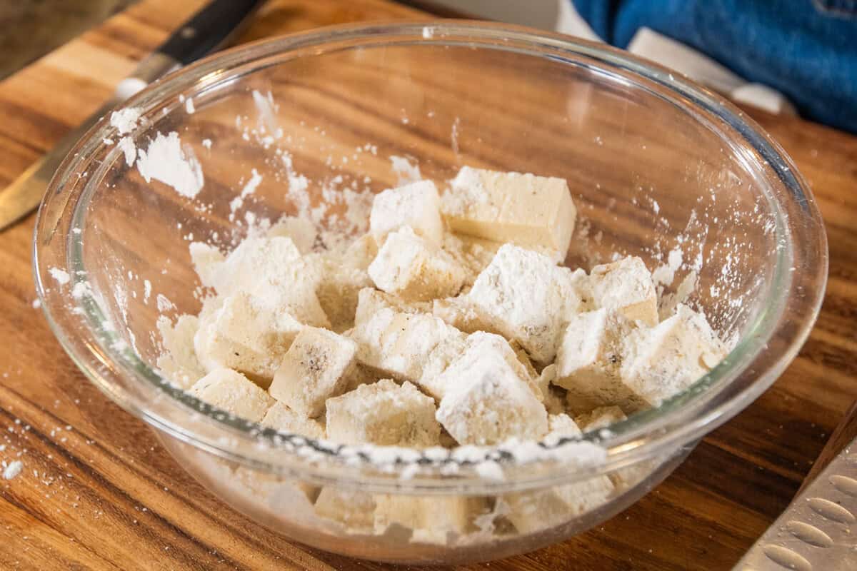 cubes of tofu coated in cornstarch and seasoning