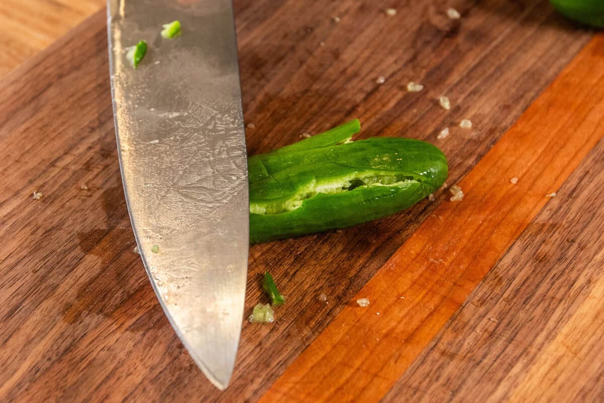 smashing cucumber with a knife