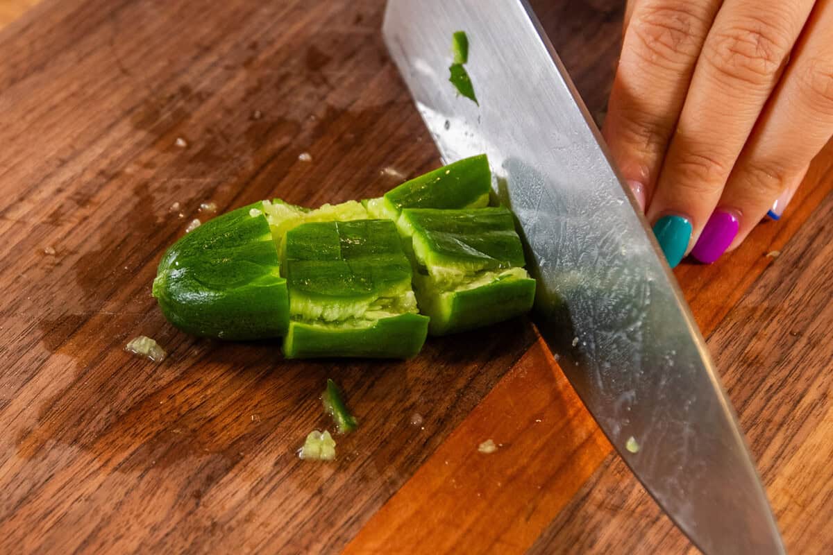 slicing chopped cucumbers
