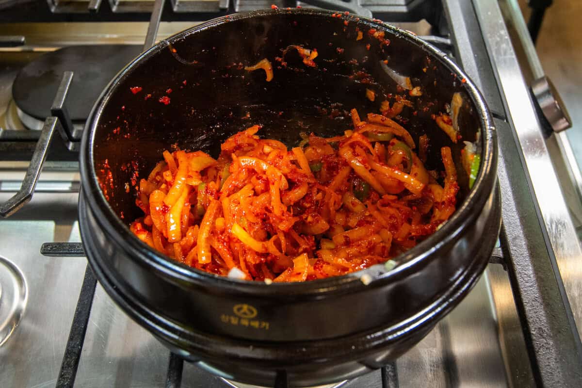 cooking onions in red pepper flakes and gochujang