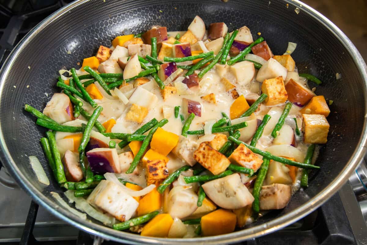 veggies and coconut milk in a pot